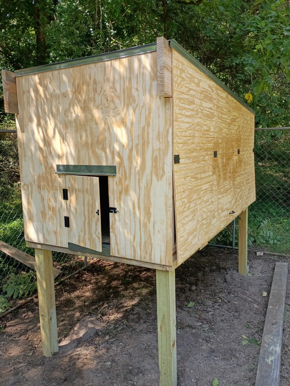 Completed custom chicken coop built by Hucks Construction