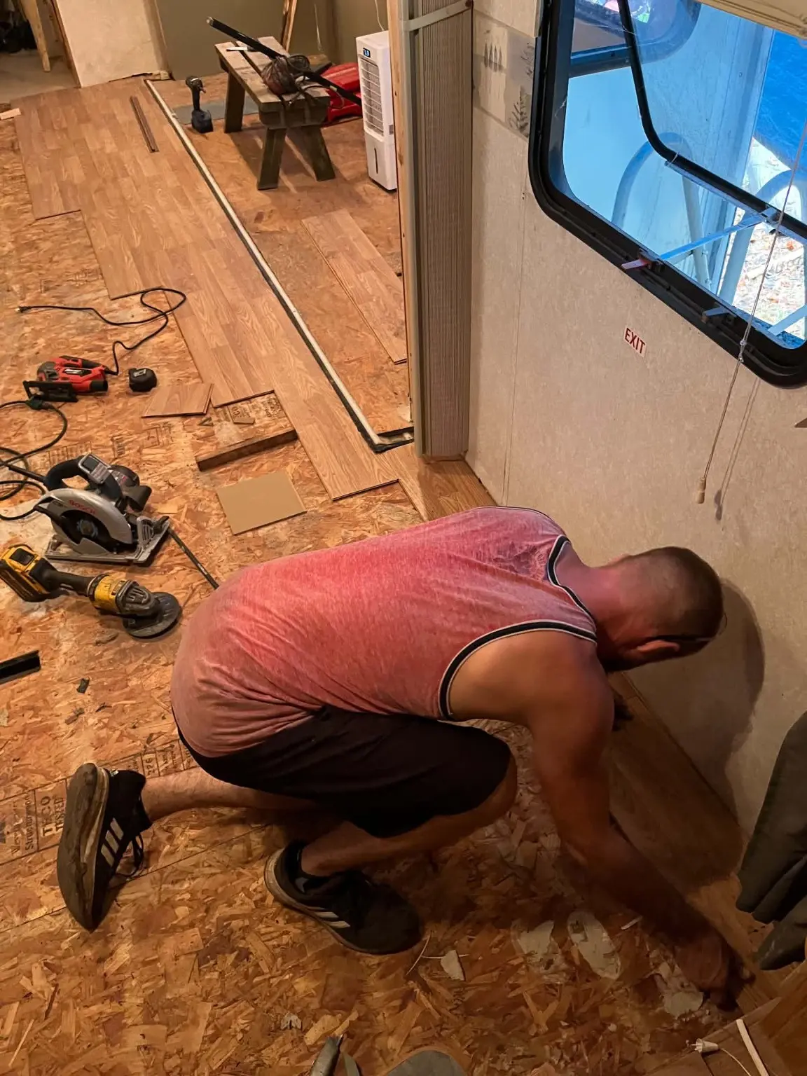 Floor replacement work underway inside the camper