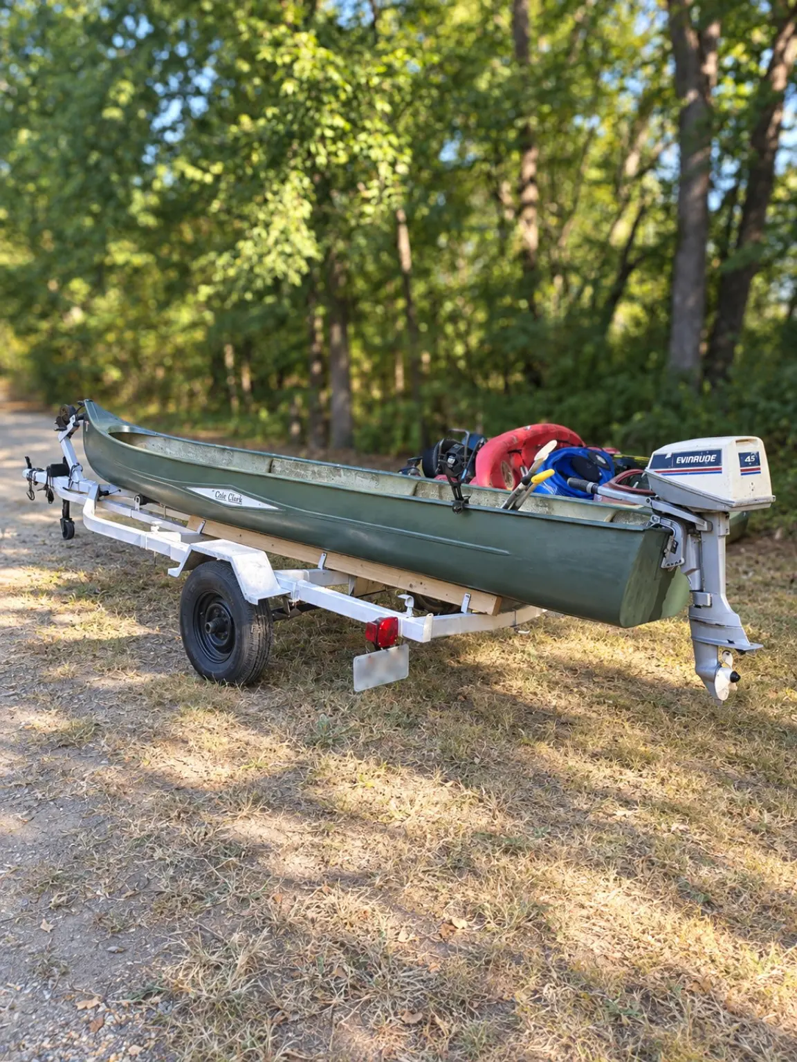 Rebuilt canoe and welded trailer viewed from the side
