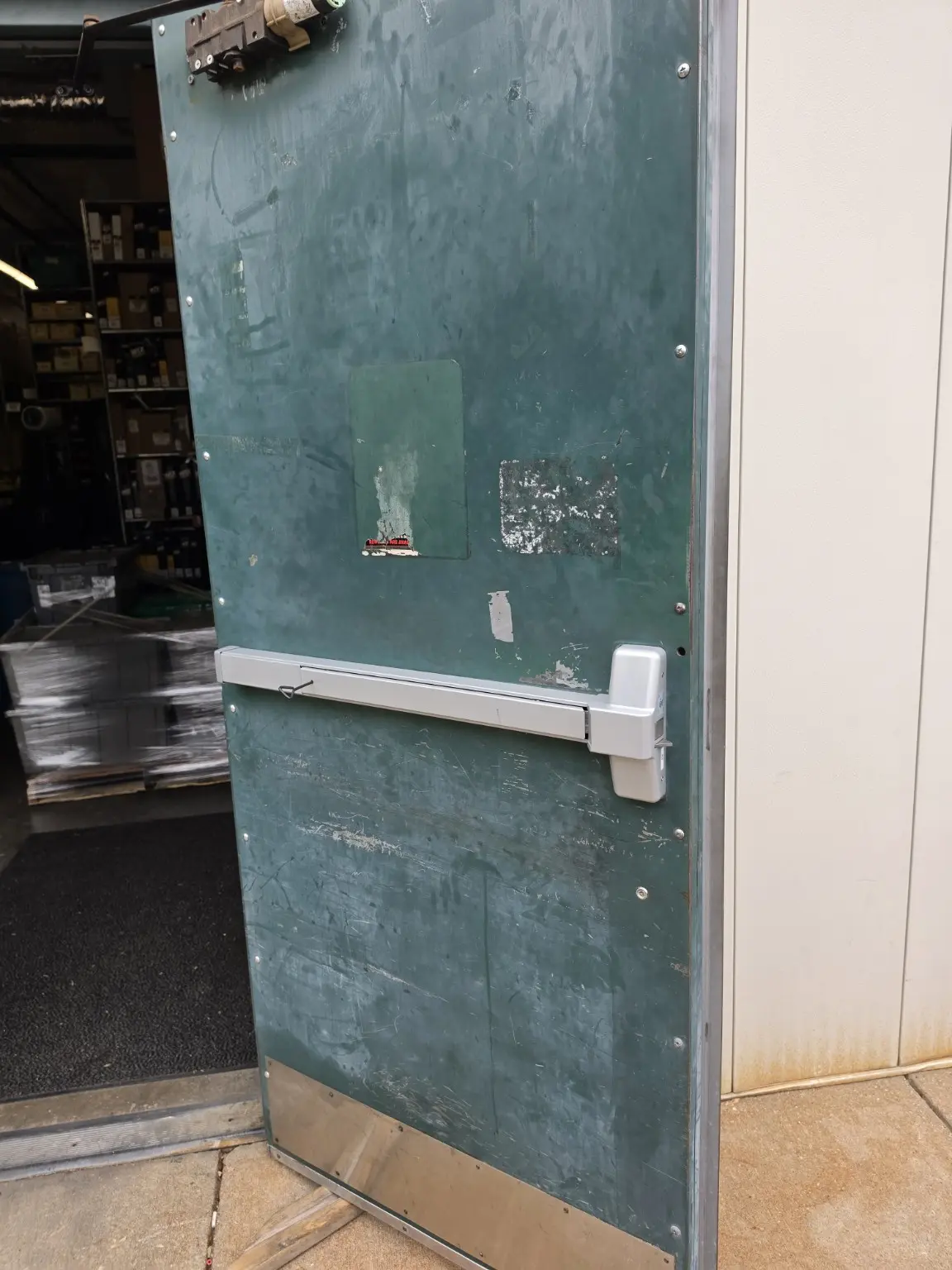 Exit door panic bar during repair