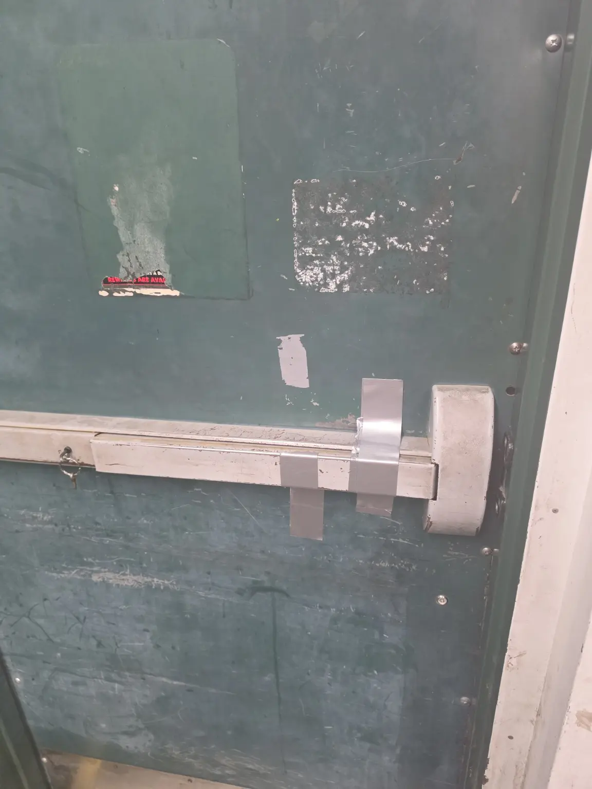Exit door hardware reassembled after troubleshooting