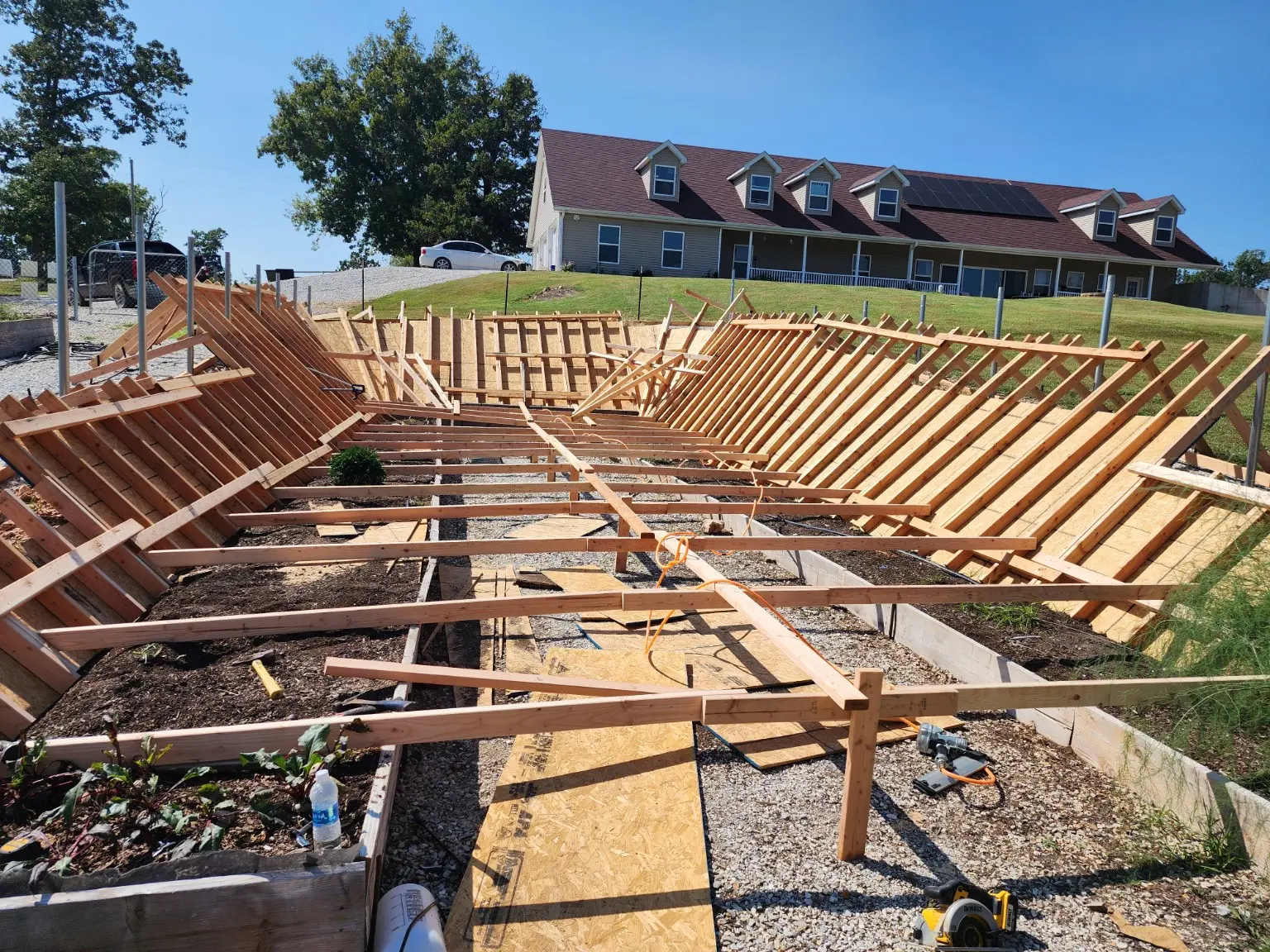 Wide view of timber greenhouse foundation forms