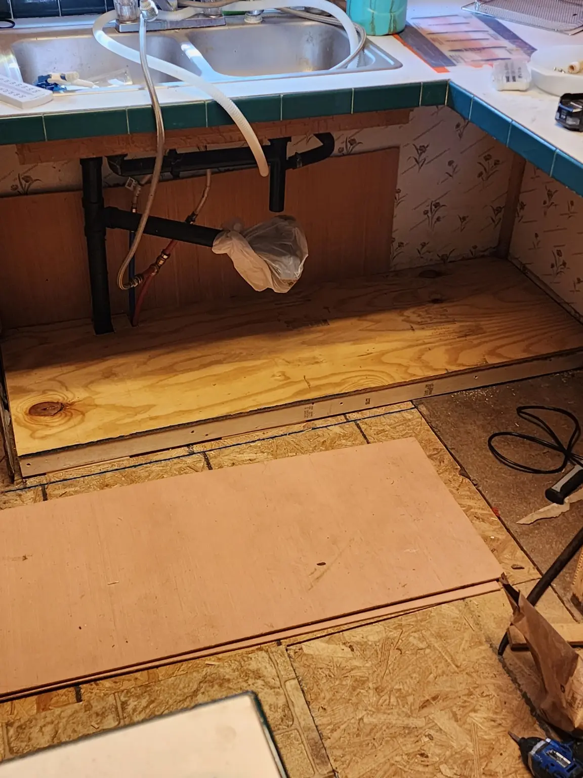 Kitchen floor opened to sound framing