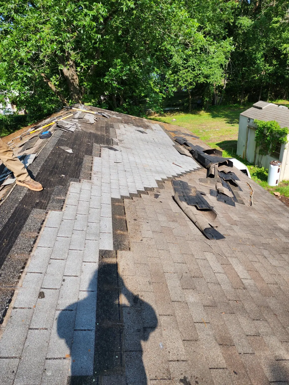Roof shingles being removed during repair work